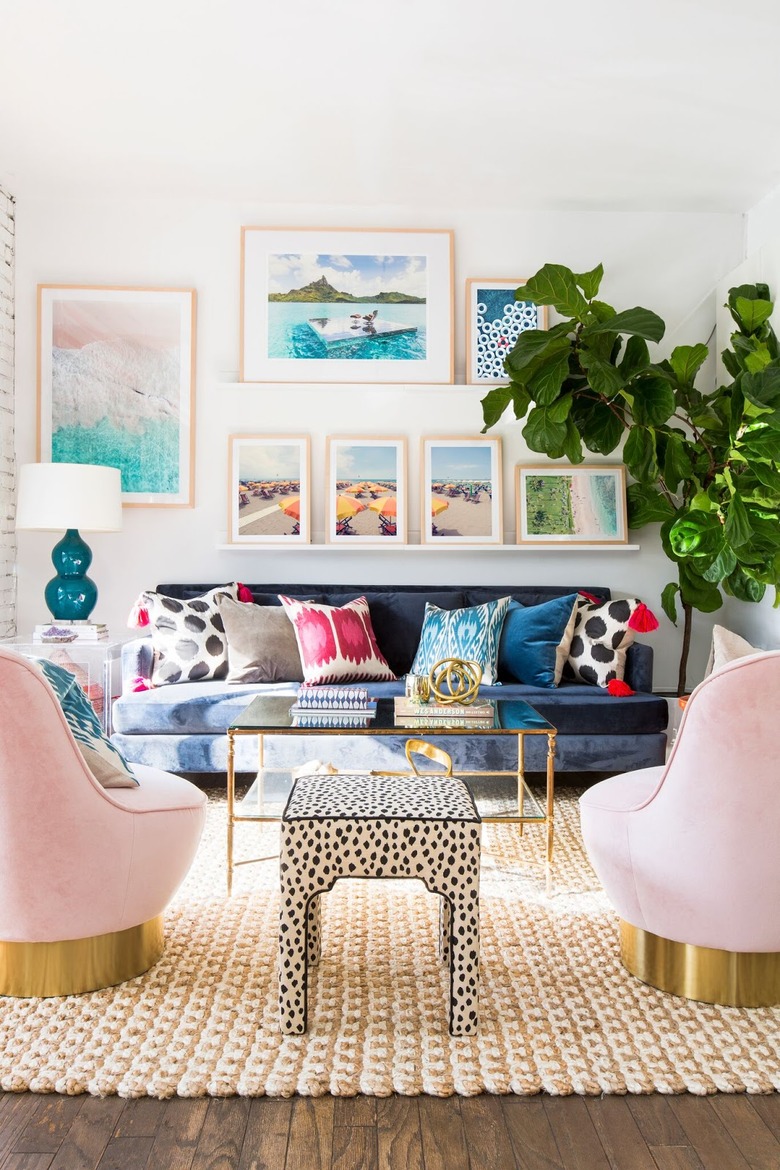 modern living room makeover idea with pink velvet chairs and colourful cushions