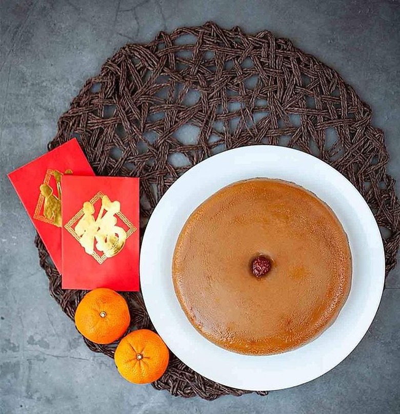 Oh My Food Recipes Nian Gao next to tangerines and red envelopes