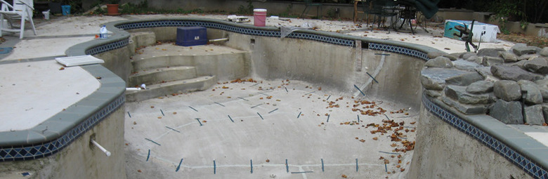 Empty concrete pool under repair