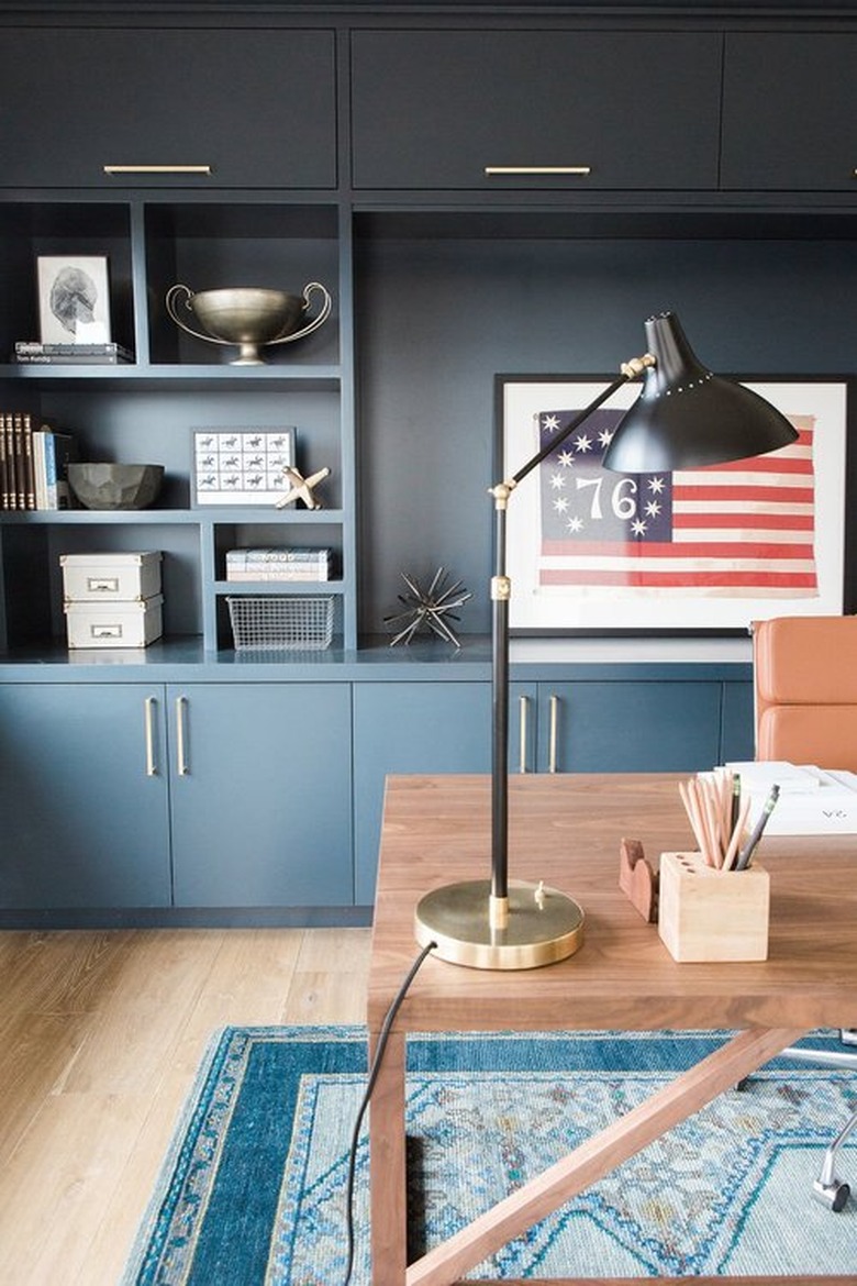 Fathers Day man cave idea with blue cabinets and wooden desk