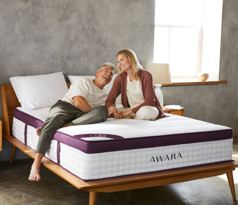 Couple Sitting on Awara Premier Latex Hybrid Mattress