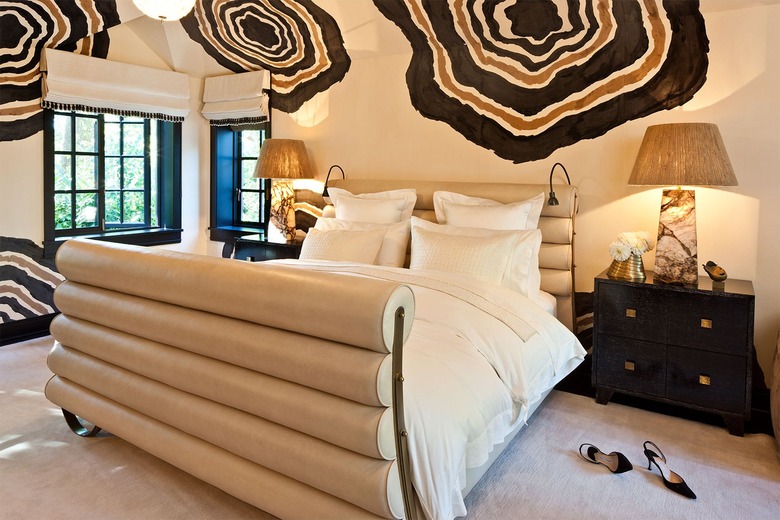 maximalist bedroom with geode print walls and neutral palette