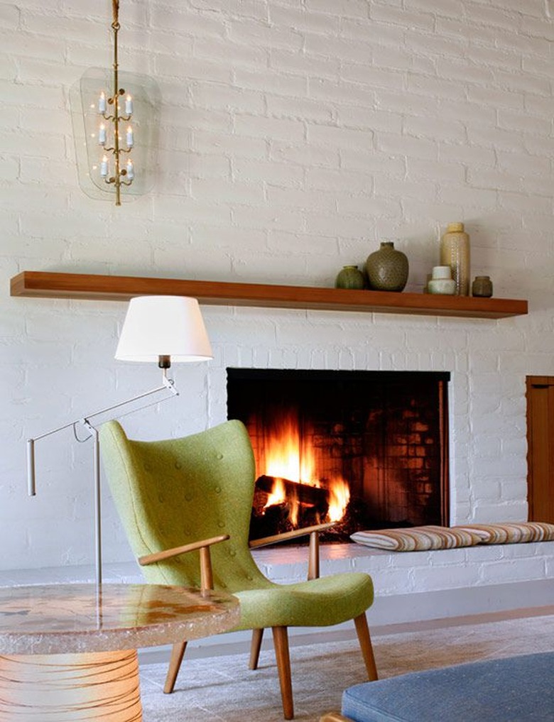 midcentury living room with white brick fireplace