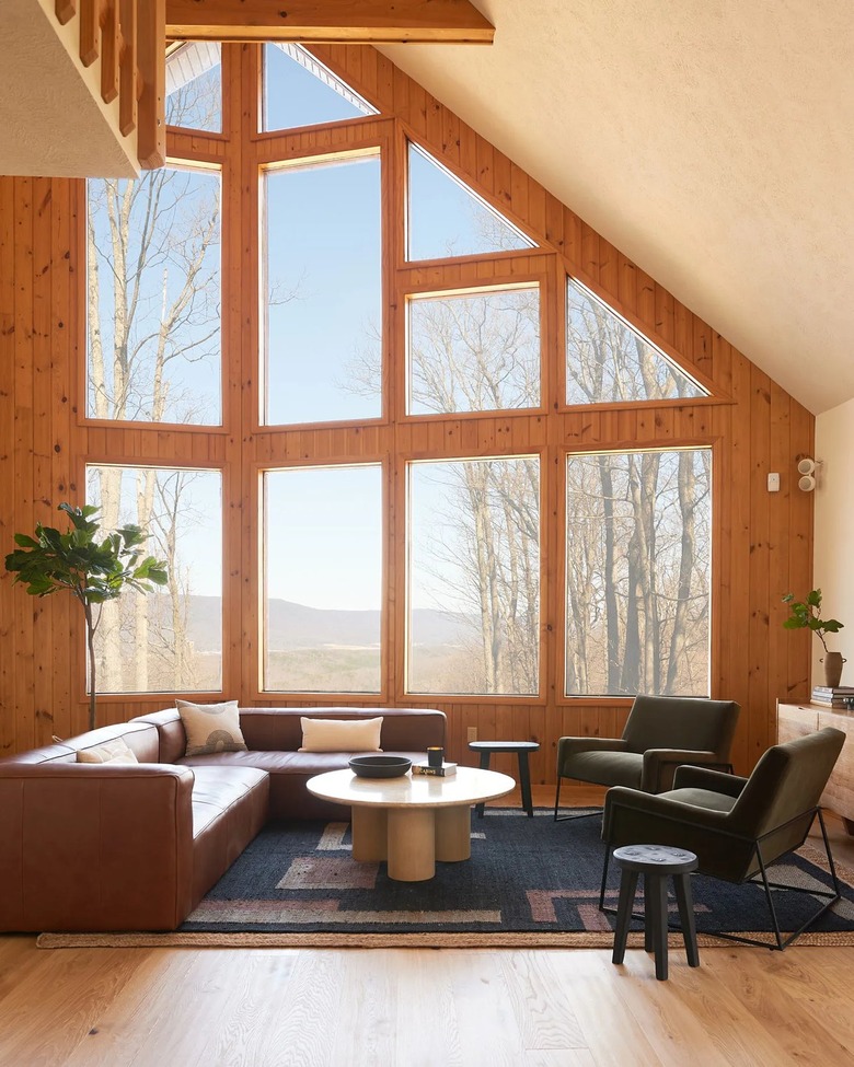 midcentury living room with floor to ceiling windows