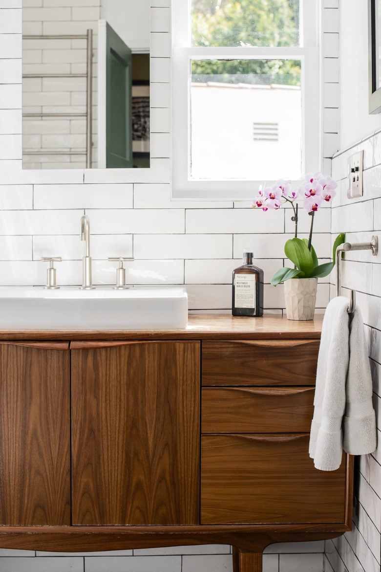 Midcentury Modern Bathroom Sink, mirror, subway tile, plant, towel,