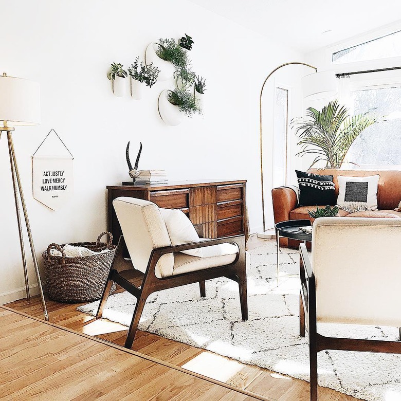 Midcentury modern bohemian living room with plants and midcentury furniture