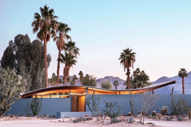 blue midcentury modern exteriors on wave house