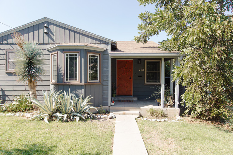 grey home with red door