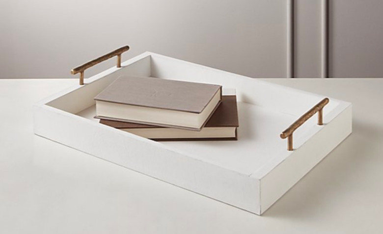 white leather tray with two books