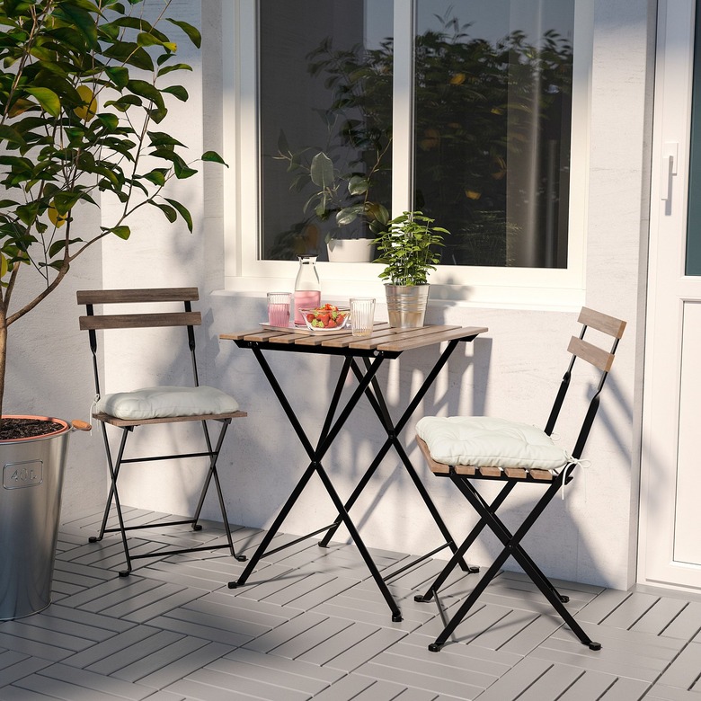 white minimalist balcony idea with table and two chairs