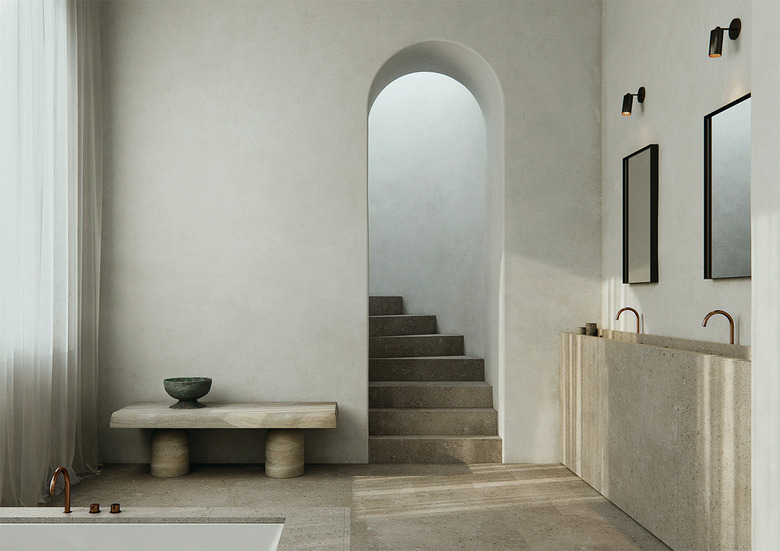 minimalist bathroom vanity made of concrete with two mirrors