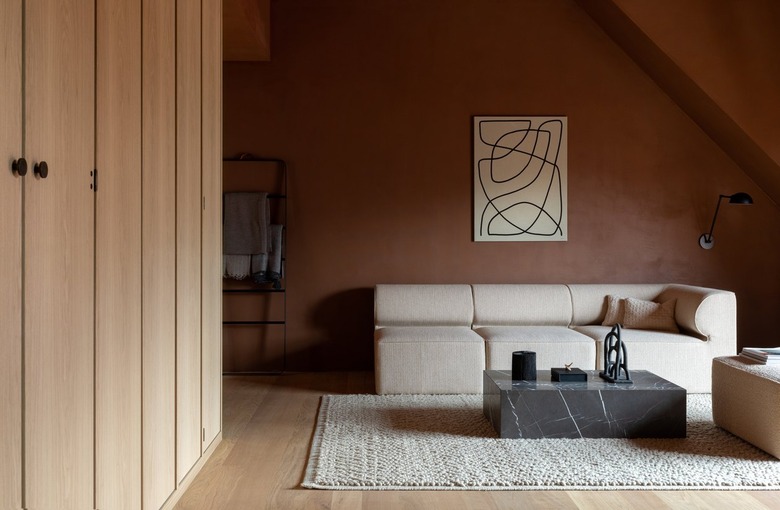 living room with terra cotta wall paint