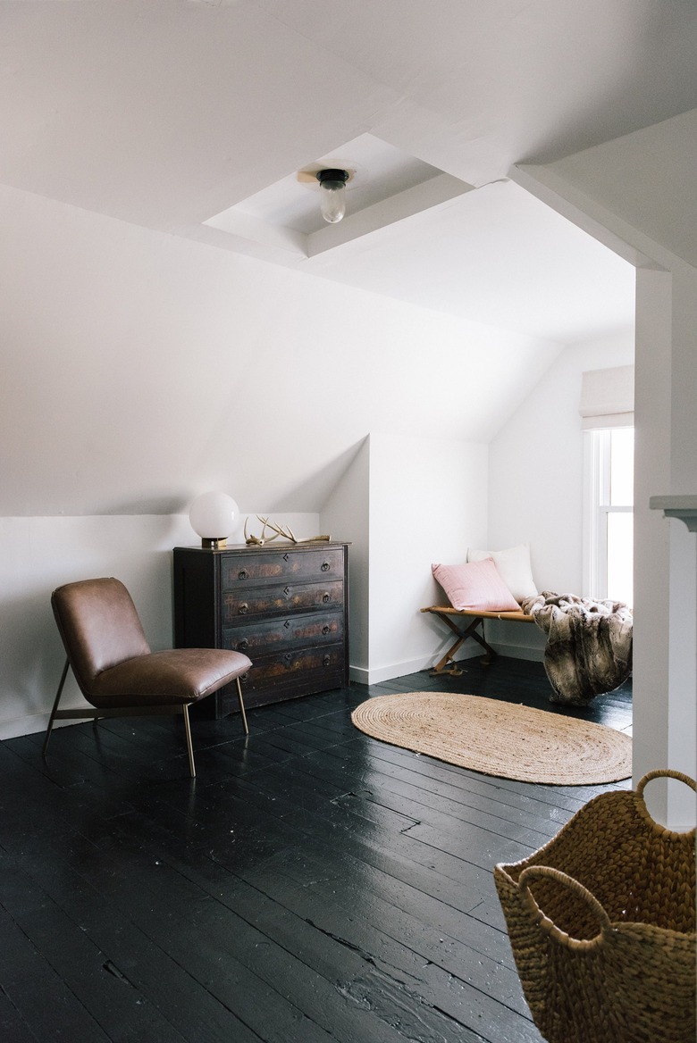 Painted black minimalist flooring in black and white room