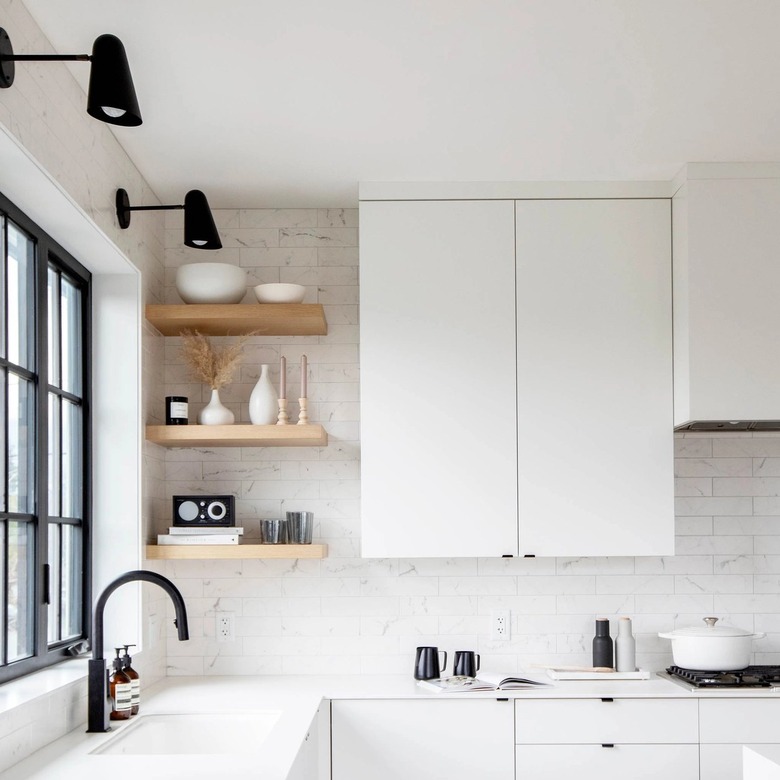 modern white kitchen with marbled white backsplash