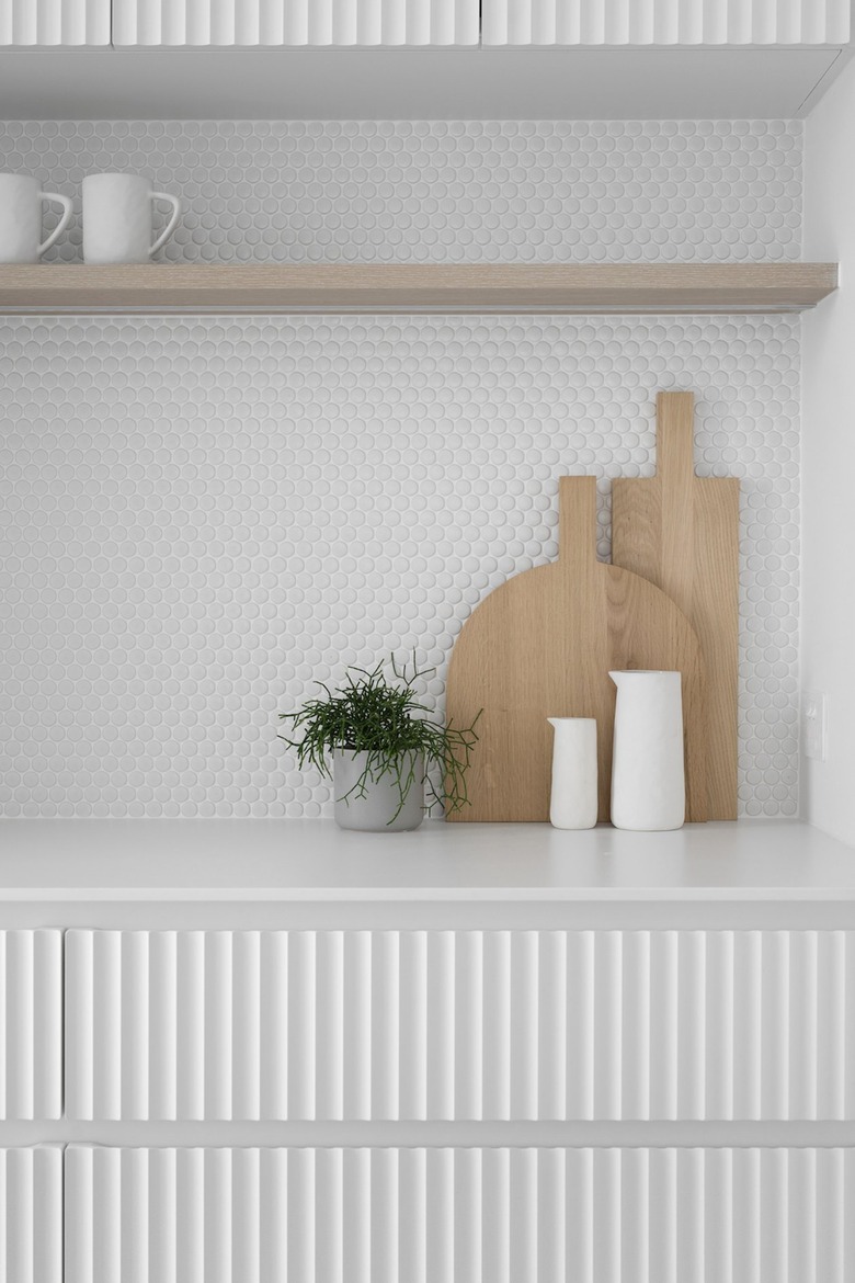 white textured backsplash and cabinets in modern kitchen