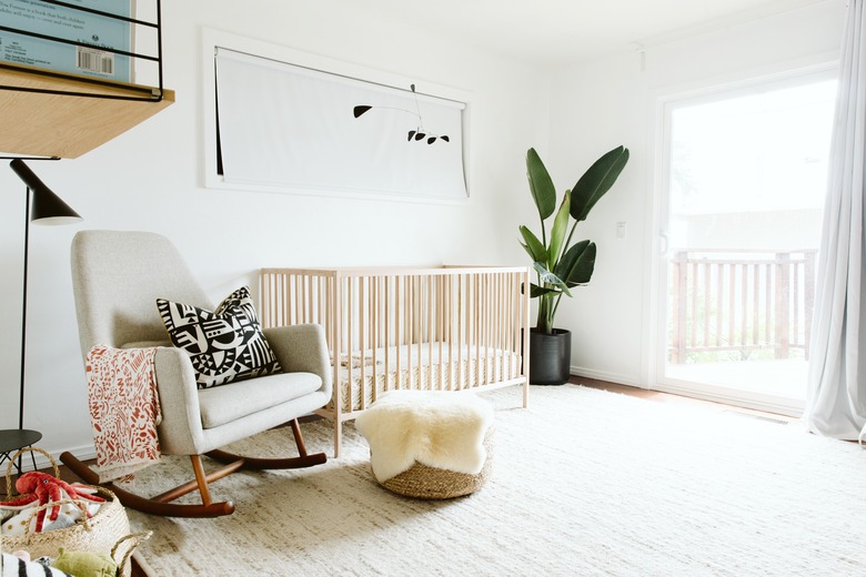 minimalist lighting in white nursery with banana tree