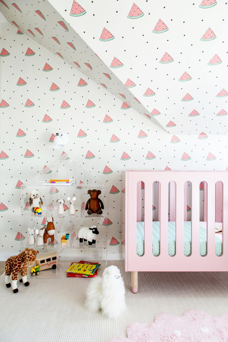 minimalist nursery decor with watermelon wallpaper and pink crib