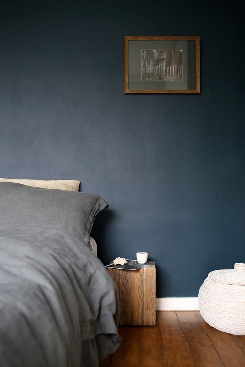 moody blue minimalist room paint colors in bedroom with gray bed