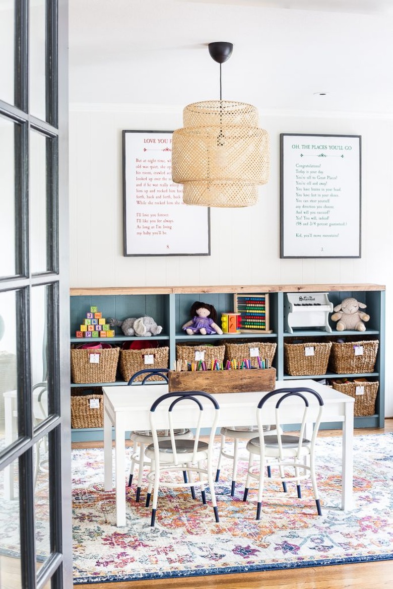 Minimalist toy storage idea with labeled storage baskets in playroom