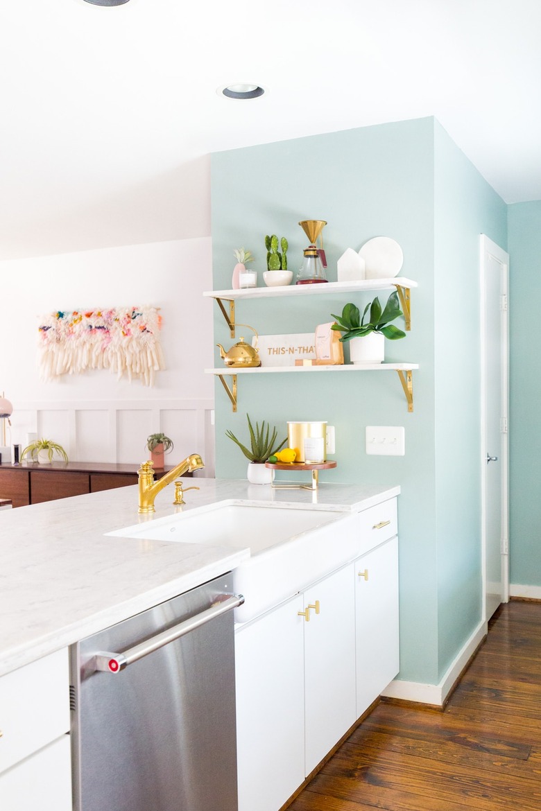 white and mint green kitchen with open shelving and farmhouse sink