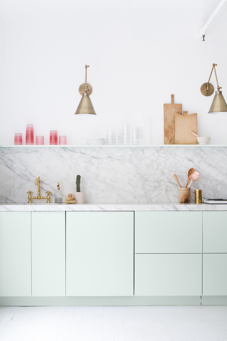 mint green kitchen with marble backsplash