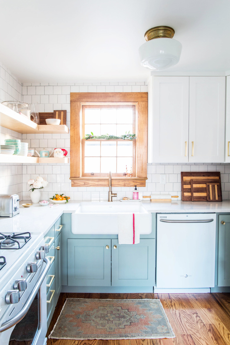 country style mint green kitchen with open shelving and subway tile backsplash