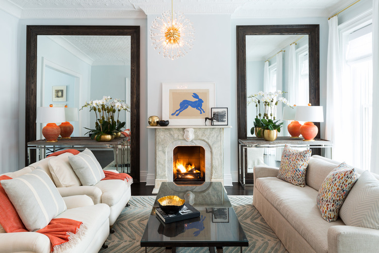 elegant living room with pair of mirrors