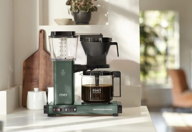 green and black drip coffee maker on counter