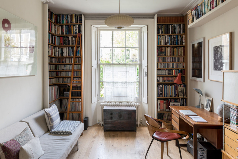 Home Office Built Ins with Floor-to-ceiling built-in library in London home on Modern Street