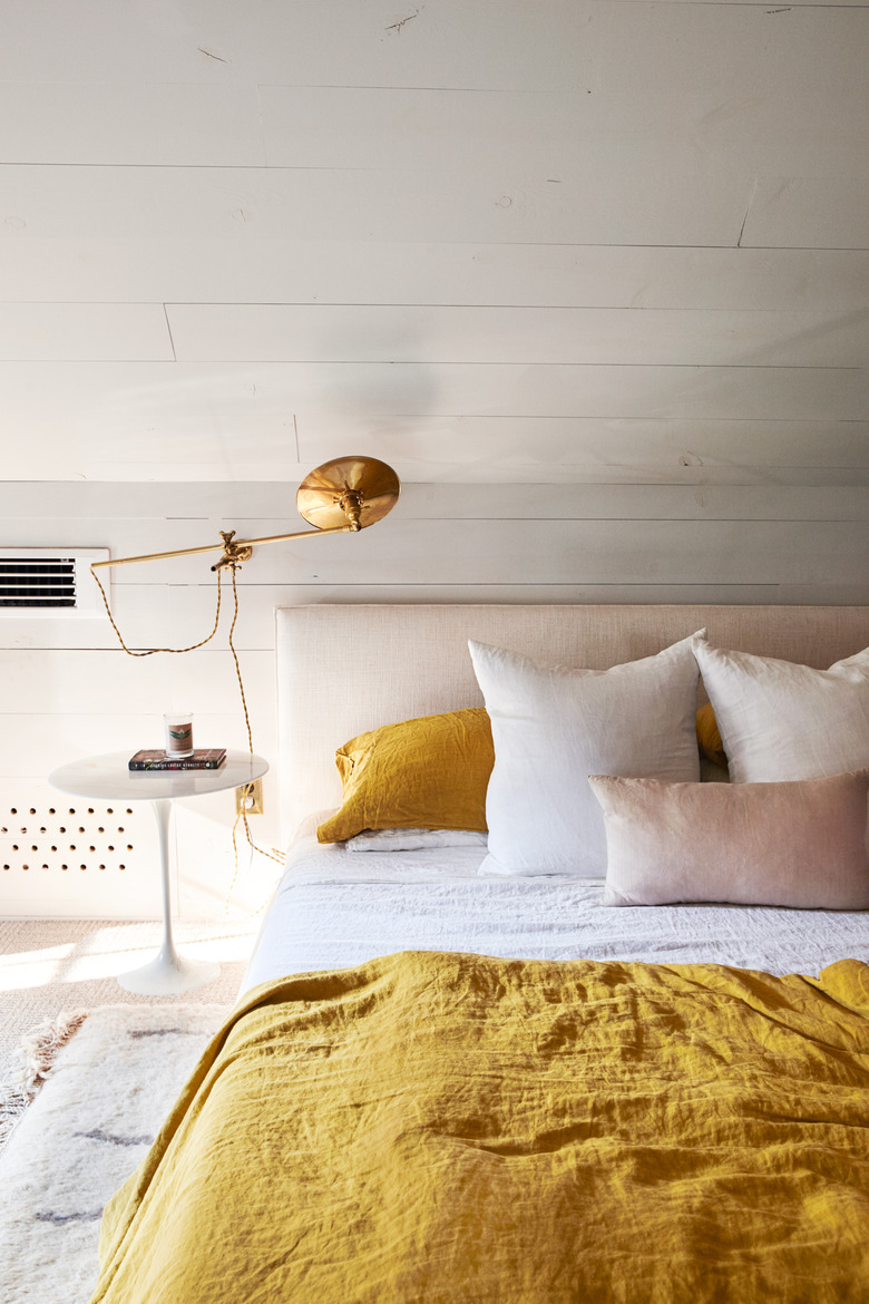 bedroom with yellow and pink bedding