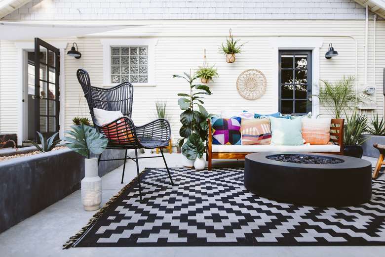 Patio furniture on black and white rug