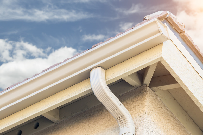 House with New Seamless Aluminum Rain Gutters.