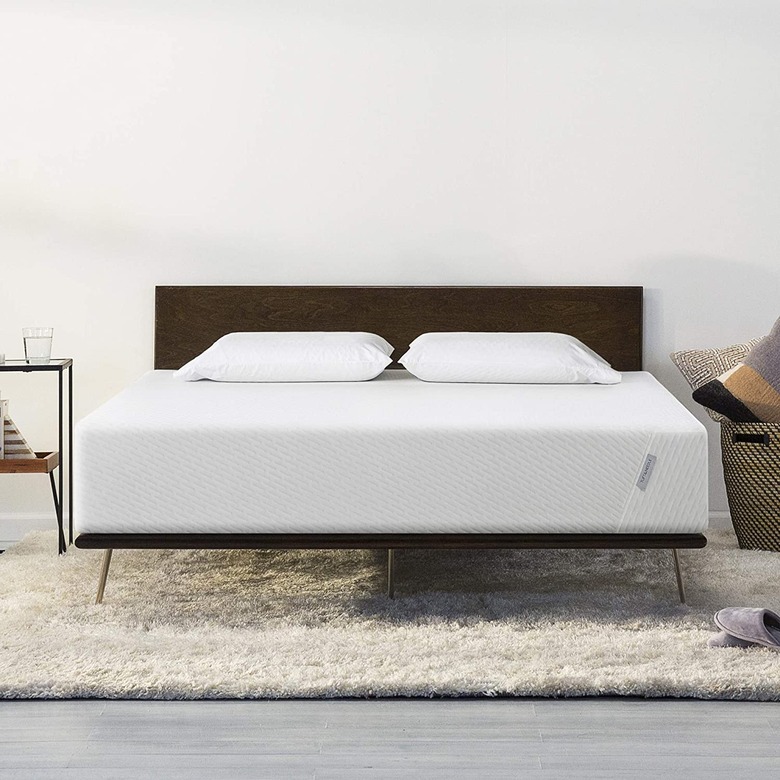 Mattress on wooden bedframe