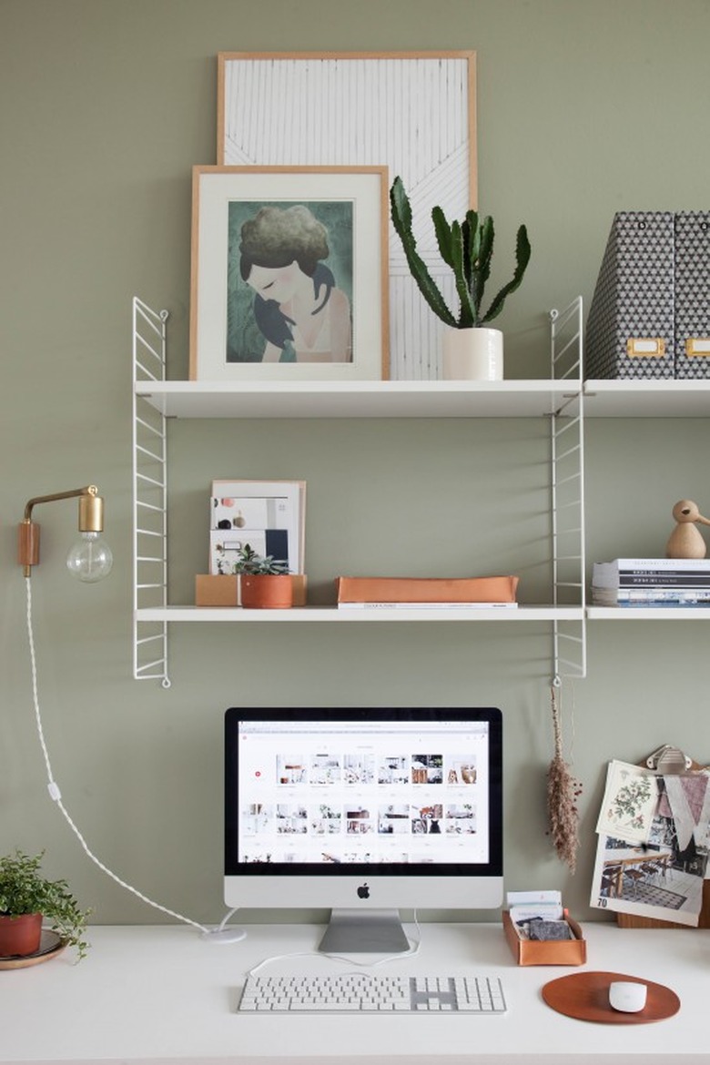 open shelving in sage green minimalist modern home office design