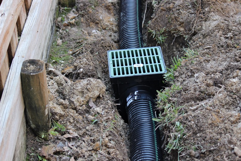 Building an Underground French Drain System after Digging the trench system to keep water away from home