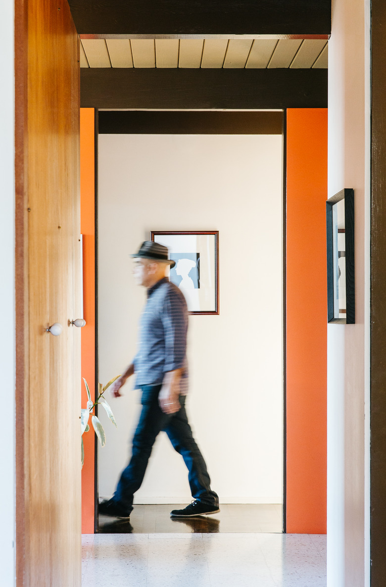 Hallway with wood and orange walls