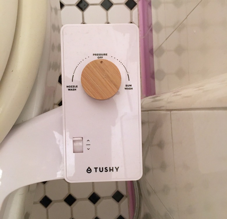 Tushy classic bidet knob showing water pressure and nozzle adjustment