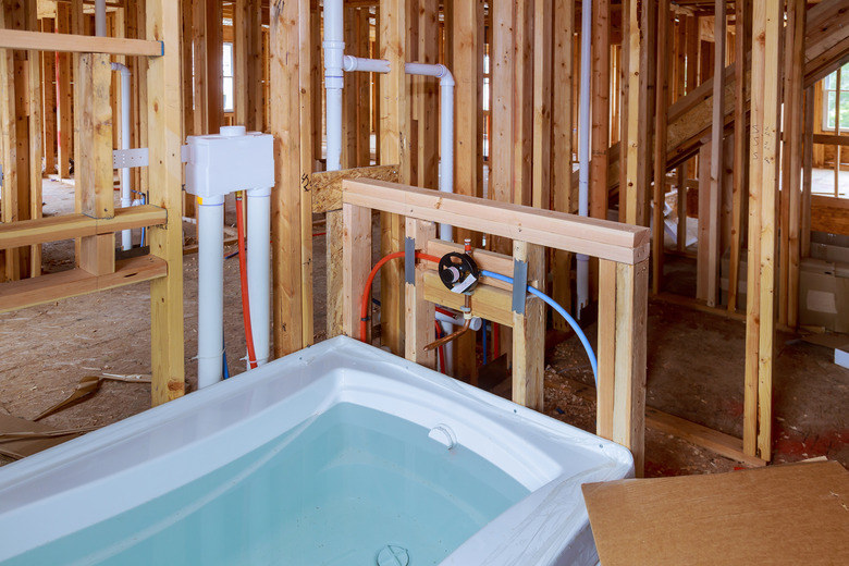 Bathroom unfinishing new home installation of plumbing, faucets, water and sewerage.