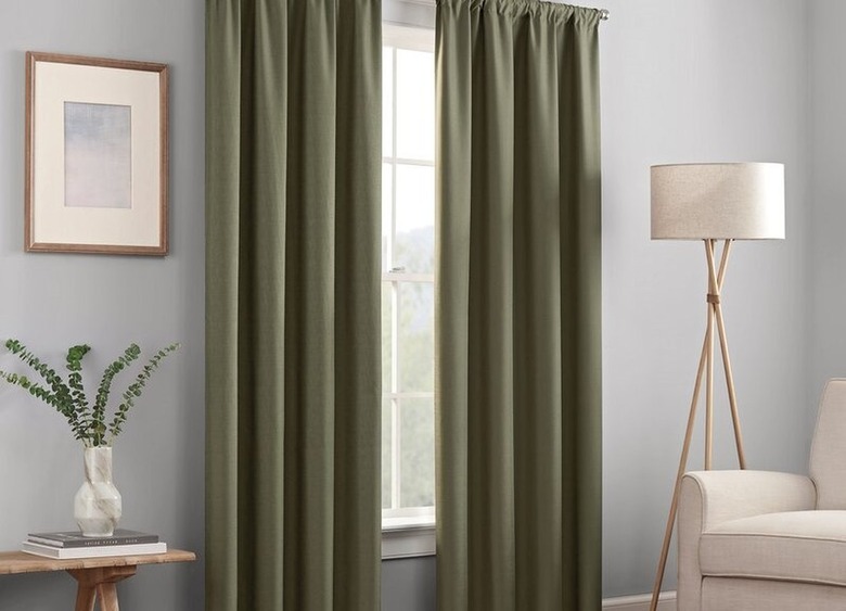 Machine-washable, lined blackout thermal rod pocket curtain panels in living room.