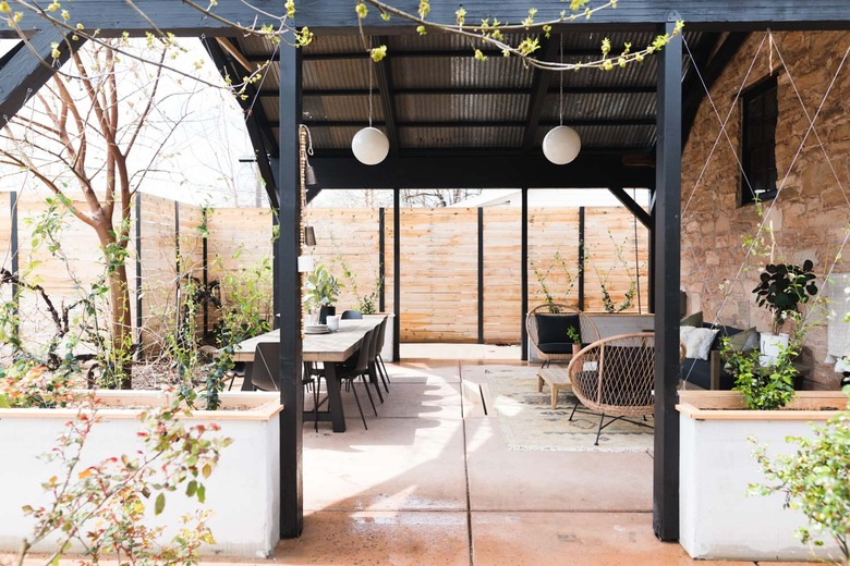 A patio before and after with wicker furniture and an outdoor rug