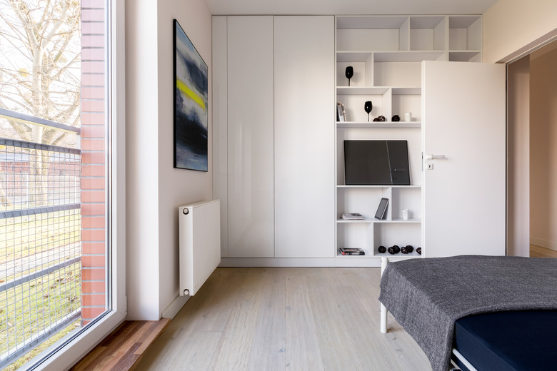 Bedroom with bookcase and wardrobe