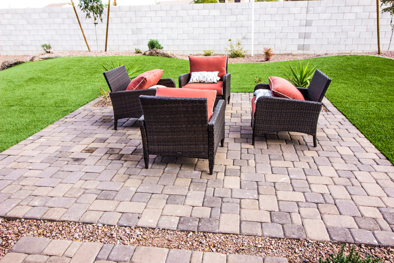 Outdoor Pavers Patio With Four Wicker Chairs