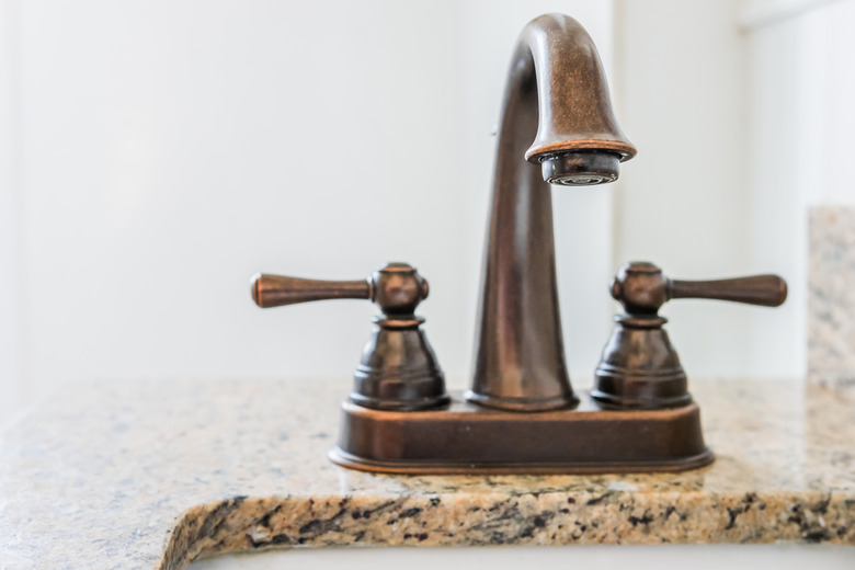 Bronze bathroom vanity faucet and sink