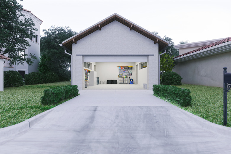 Open Garage With Concrete Driveway