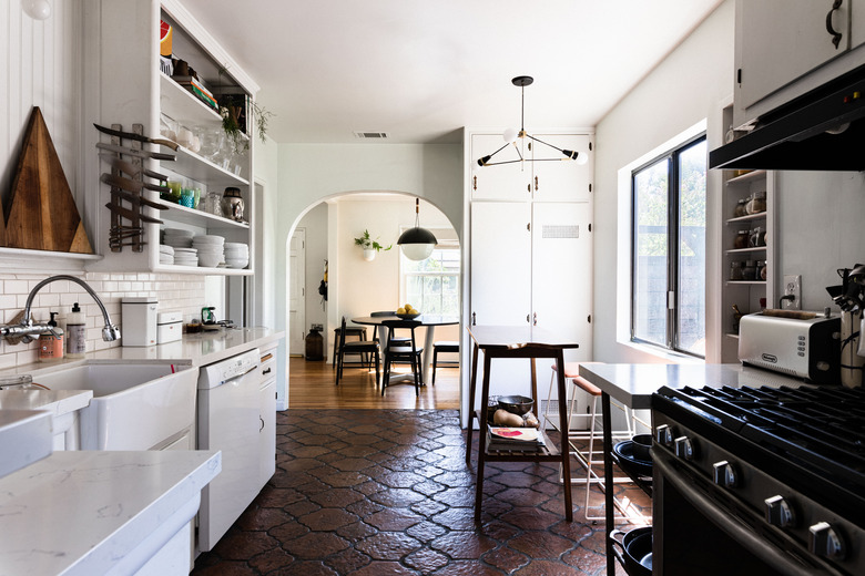 kitchen with tile floor, looking into dining area beyond