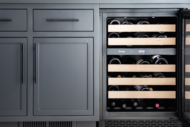 Gray cabinets with a built-in wine cooler