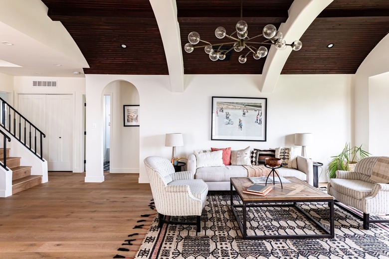 Modern chandelier-style lighting in an open plan living room