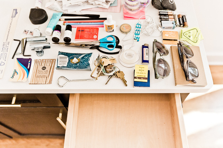 A pile of junk on top of a countertop