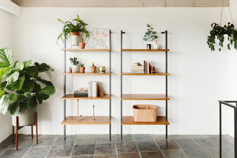 tile floor, white wall with two shelving units