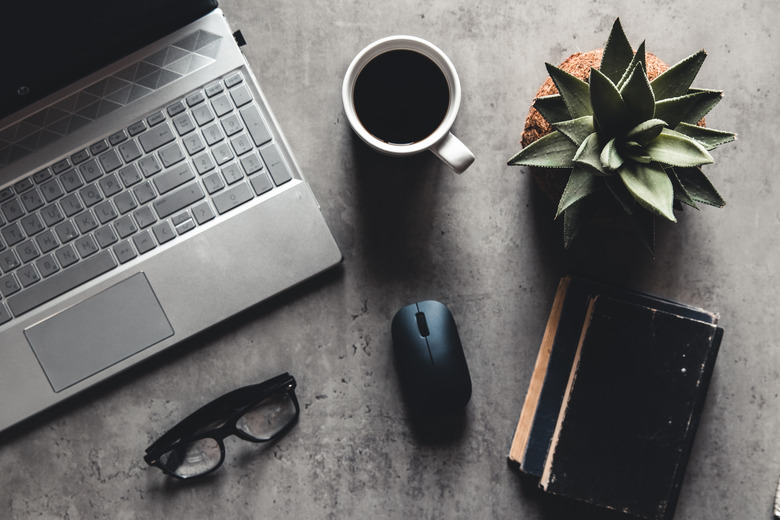 laptop and book, coffee on gray background, Top view of office desk on textured